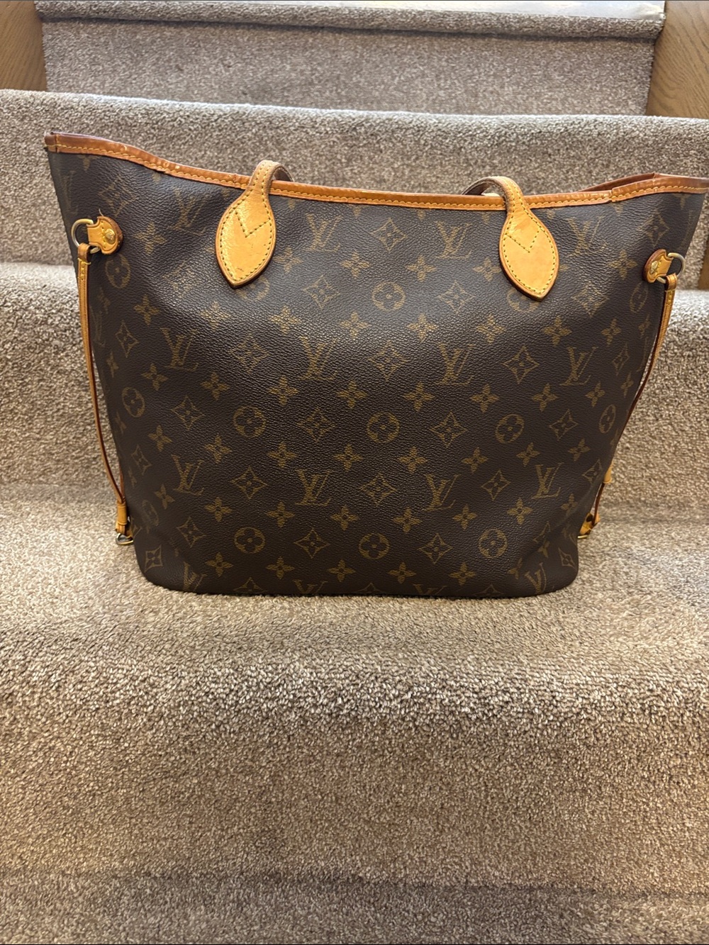 This is the Louis Vuitton Neverfull MM in the iconic Monogram Canvas.